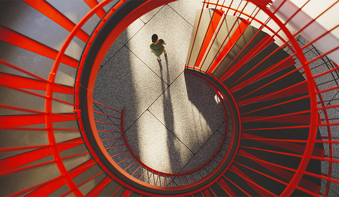 lady-in-green-dress-at-bottom-of-red-circular-stairs-bdo