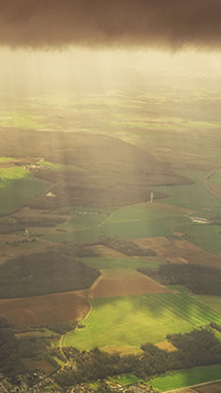 white-airliner-over-irish-landscape