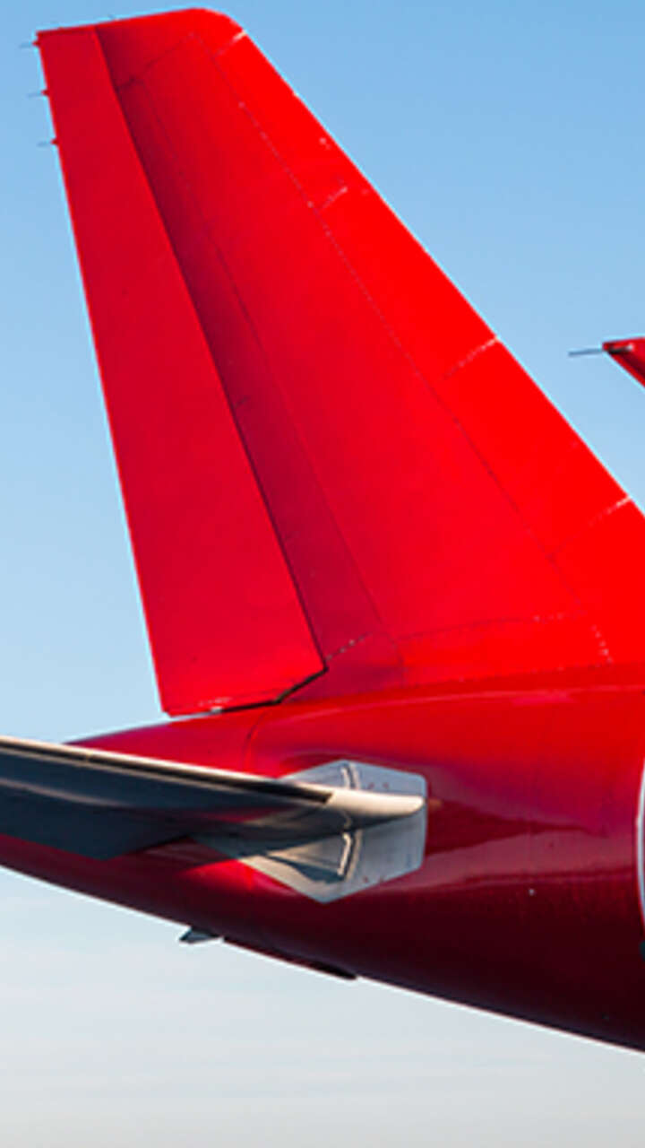 tail-rear-passenger-airplane-red-color-against-blue-sky-