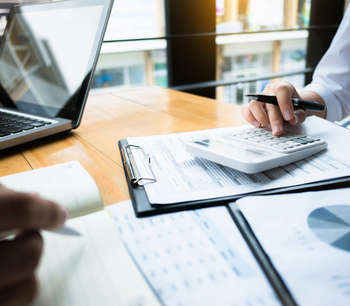2 people reviewing paperwork
