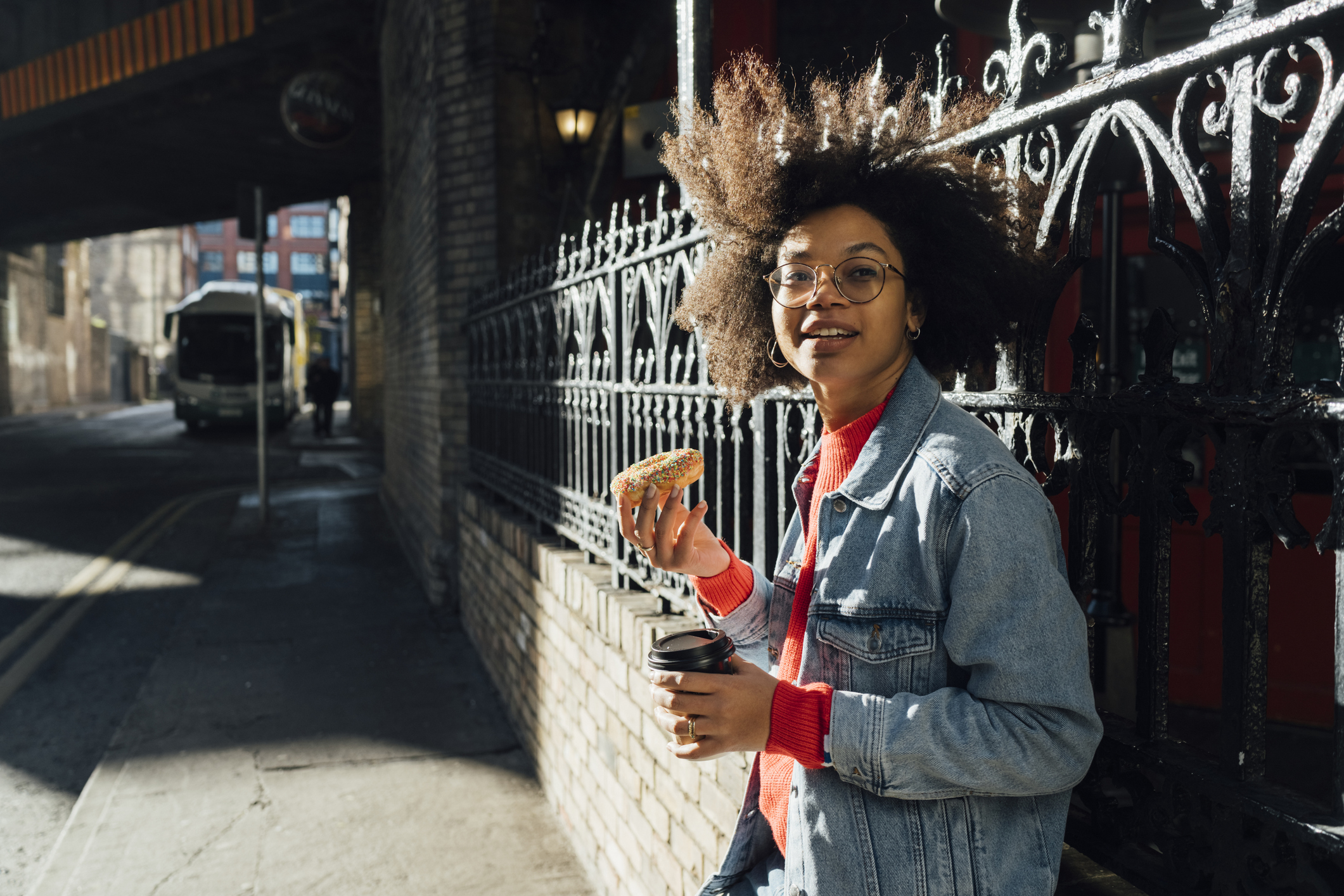 young woman with donat and coffee on image