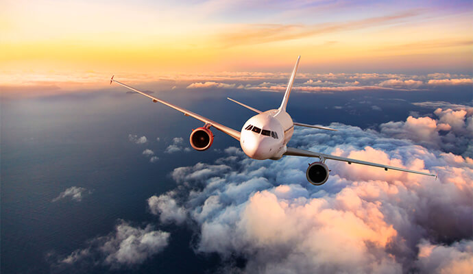 airplane-flying-over-clouds-bdo