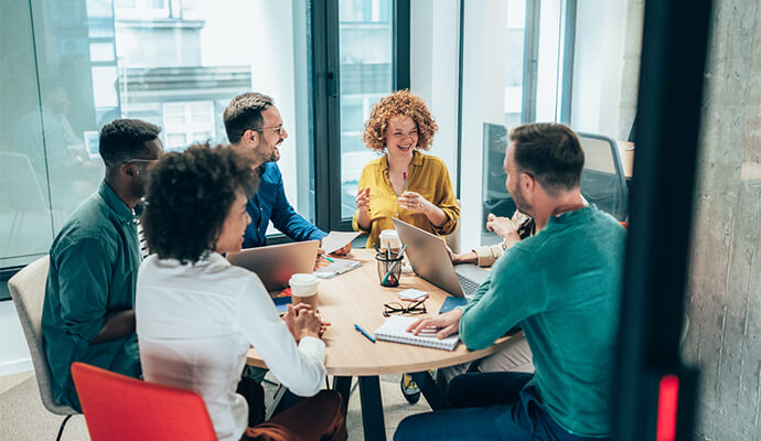 group-of-people-sitting-around-the-table