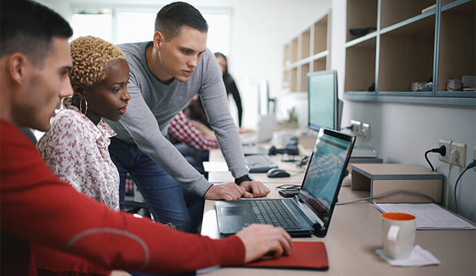 people-in-office-looking-at-laptop-thinking-bdo