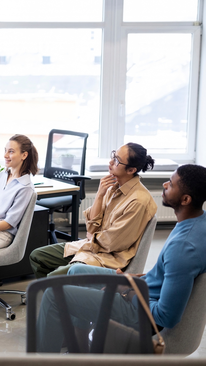 colleagues-learning-from-speaker-in-corporate-office
