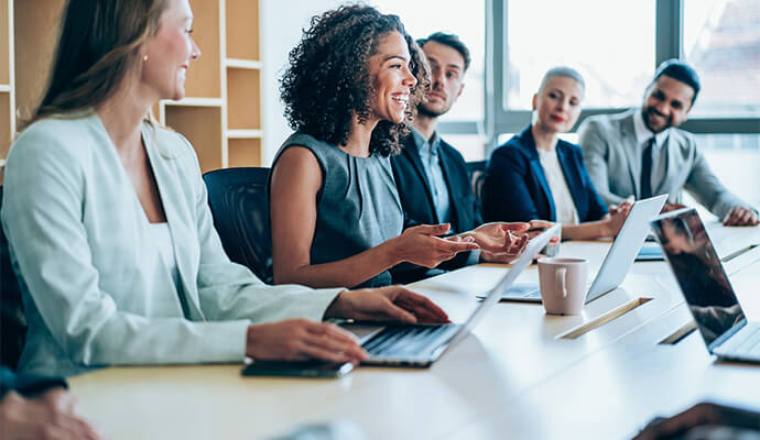 people-laughing-in-conference-room-bdo-alternative-consulting