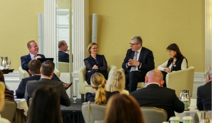 Senior-financial-services-leaders-convene-in-Dublin-group-on-stage-690-x400