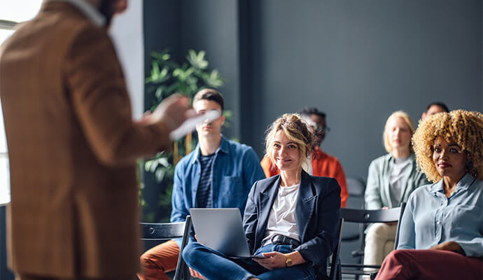 smiling-people-sitting-on-conference