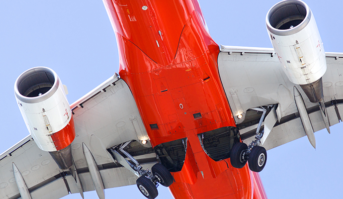 bottom-of-airplane-against-sky-background
