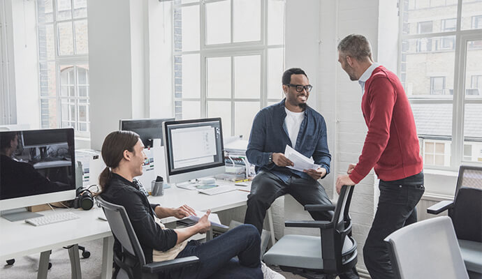 men-laughing-at-hot-desk-bdo