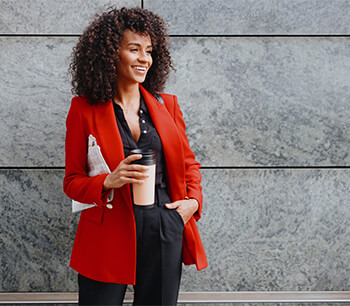 girl-in-office-attire-holding-coffee-and-newspaper-bdo