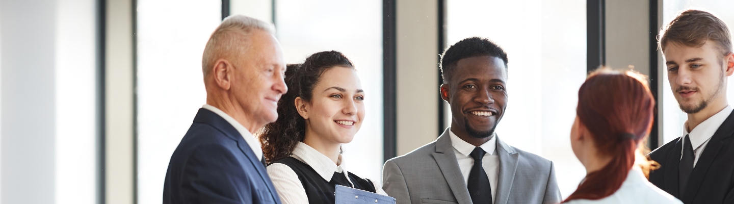 people-in-meeting-looking-at-speaker-in-corporate-office-