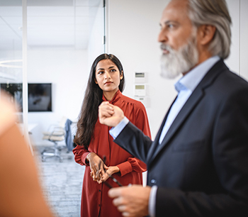 man-gesturing-talking-to-woman-bdo