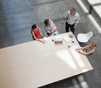 group-of-people-discussing-agenda-in-office-meeting-bdo