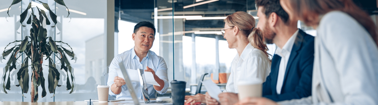 people-in-meeting-looking-at-speaker-in-corporate-office-